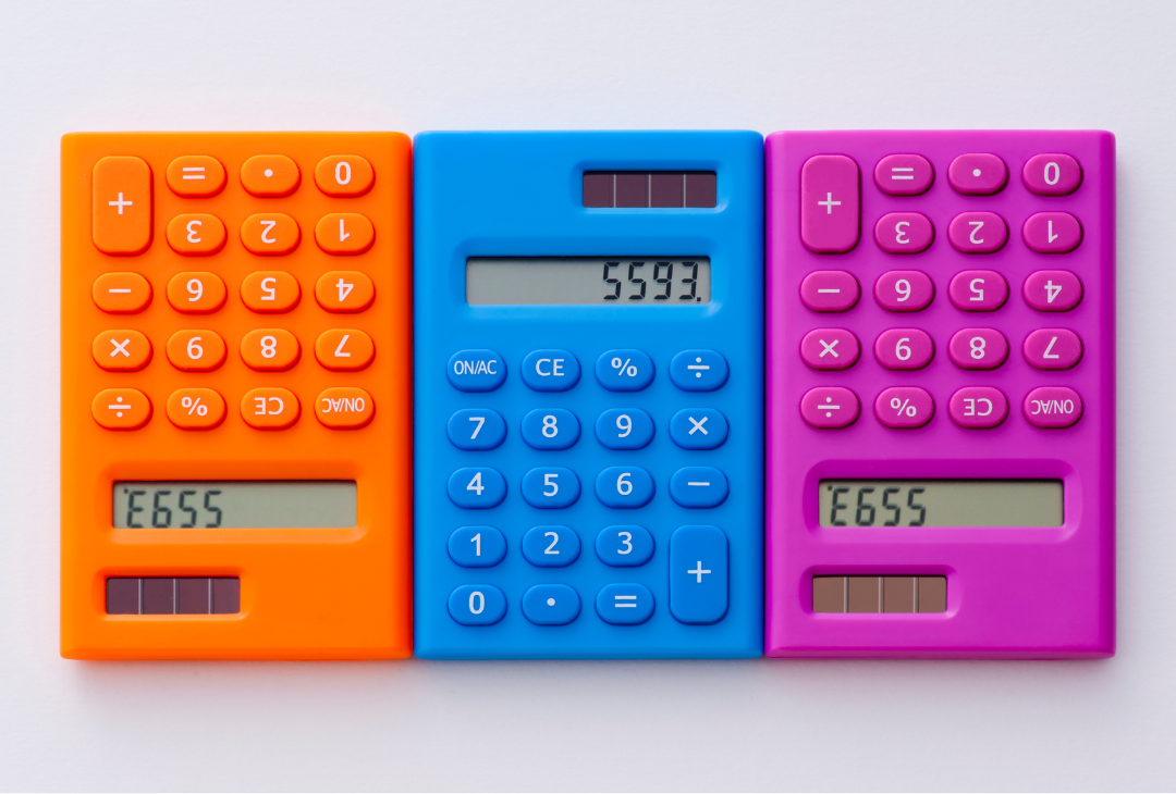 An orange, blue and pink calculator.